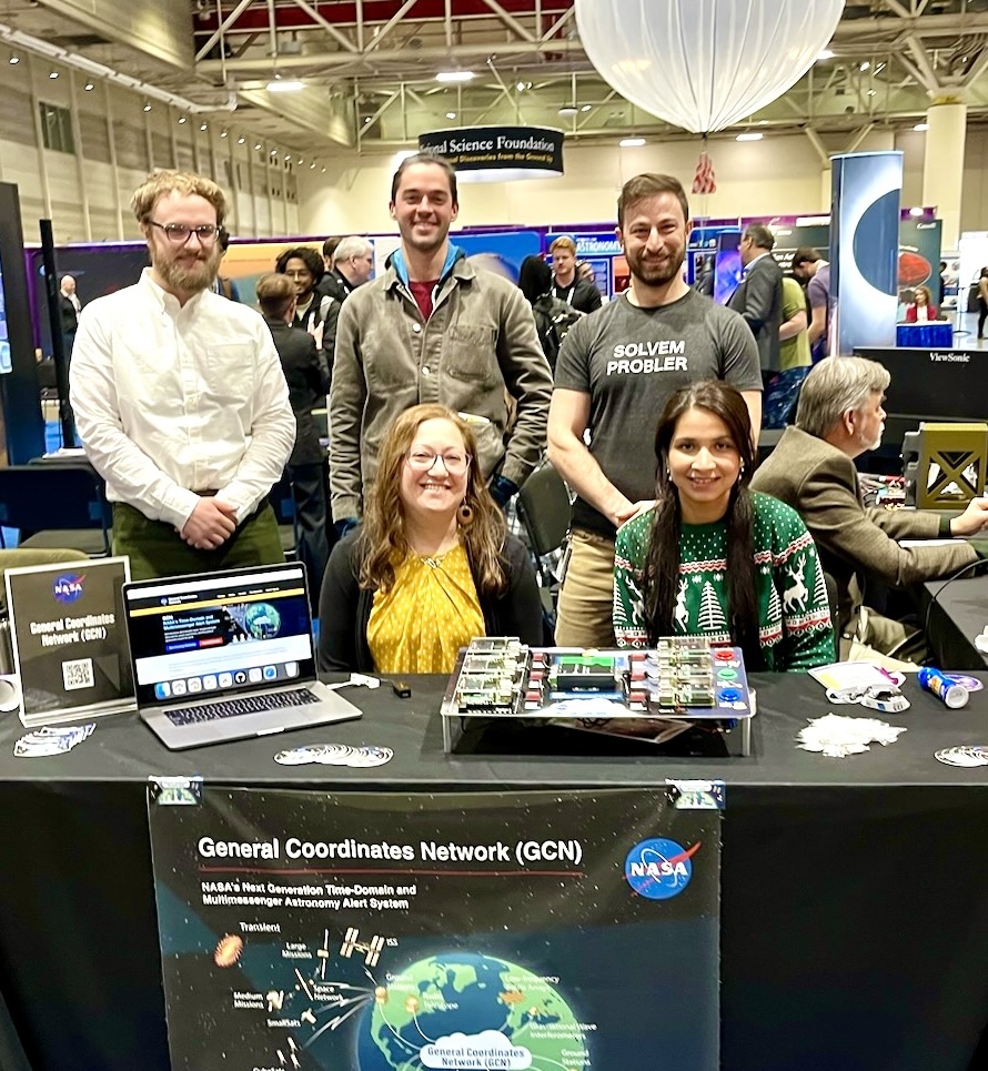 Group photo of the General Coordinates Network (GCN) team during the American Astronomical Society Meeting (AAS) in January 2024. In the front row are Dr. Judith Racusin and Dr. Vidushi Sharma. Standing in the back from left to right are Tyler Barna, Dakota Dutko, and Dr. Leo Singer.